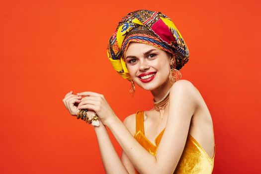 cheerful woman in multicolored turban attractive look Jewelry isolated background