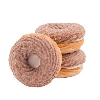 Creamy chocolate shortbread sandwich cookies in shape of ring with milk filling