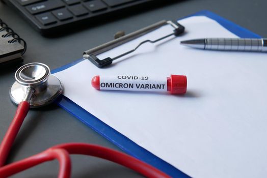 omicron variant corona virus blood test tube on red background