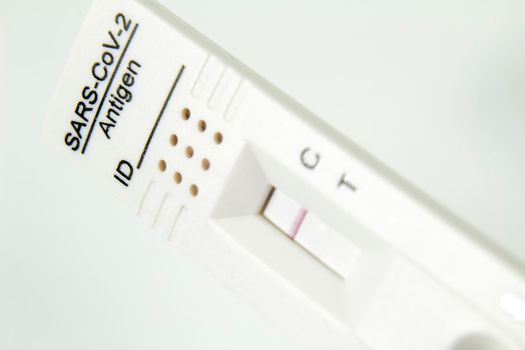 Positive Rapid Diagnostic test cassette on white background