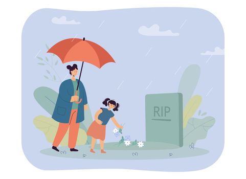 Mother and daughter standing at headstone under umbrella in rain