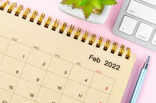 February 2022 desk calendar with keyboard computer 