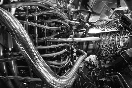 Gas turbine engine located inside the aircraft. Clean energy in a power plant used on an offshore oil and gas refining central platform. Oil gas, ecology and clean energy concept