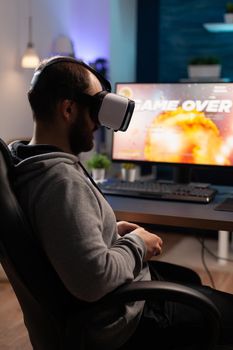 Person wearing vr glasses to play video games with controller
