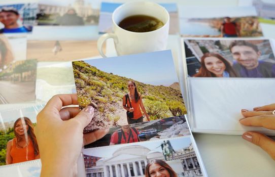 Girl looking at her printed photos, remember nostalgia for a day of rest