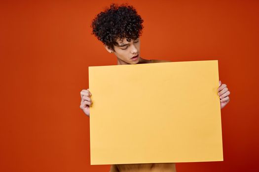 guy holding a banner isolated background studio copy-space