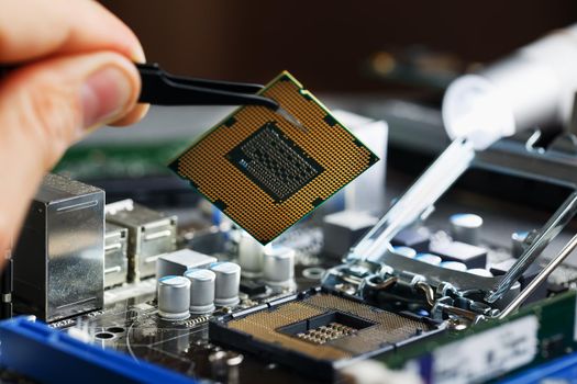 Electronic engineer of computer technology. Maintenance computer cpu hardware upgrade of motherboard component. Pc repair, technician and industry support.