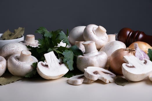 Bunch of whole raw fresh champignons with other cooking ingredients