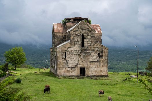 An ancient Bedian temple in the mountains of the Republic of Abkhazia. Cloudy day May 19, 2021