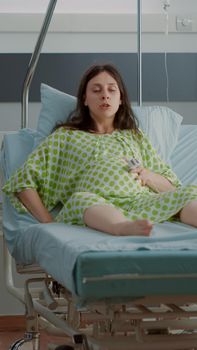 Caucasian pregnant woman having pain from contractions