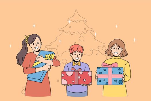 New year holidays celebration concept. Group of happy excited kids children standing holding present boxes in hands with Christmas tree at background vector illustration