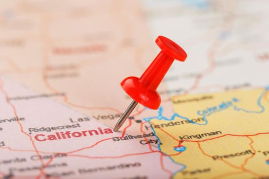 Red clerical needle on a map of USA, California and Sacramento Capital. Close up map of California with red tack