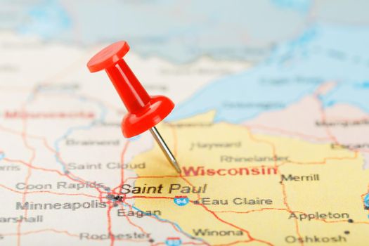 Red clerical needle on a map of USA, Wisconsin and the capital Madison. Close up map of Wisconsin with red tack