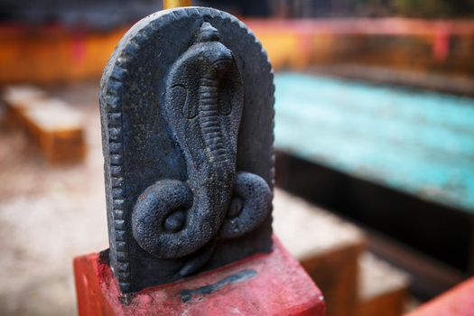 A small statue of the Snake, the temple of the serpent in India Gokarna