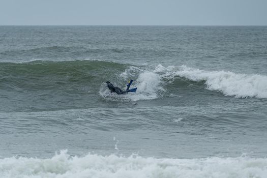 Bodyboarder performing a 360 trick