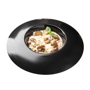 Isolated portion of gourmet risotto with truffles
