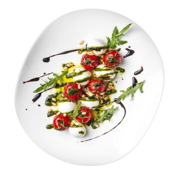 Isolated portion of gourmet caprese salad