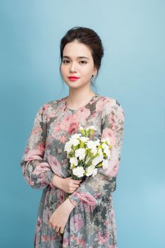 Asia attractive young woman on blue background