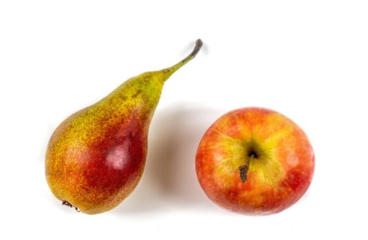 Apple and pear seen from above on white background