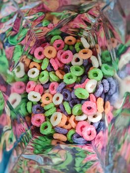 Colorful fruit corn cereal rings in bag. close up shot of this nutritious and delicious breakfast and snack favorite.