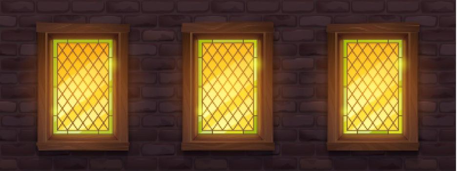 Old brick wall with glow stained windows at night
