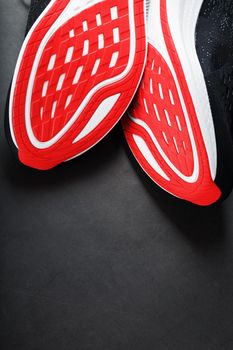 Close-up of the sole of a sport running shoe for running in red