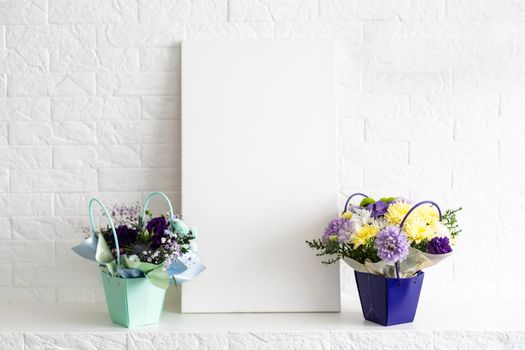 Modern home decor mock-up, bouquet and photo frame.