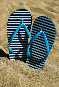 Flip-flop shoes on the sand