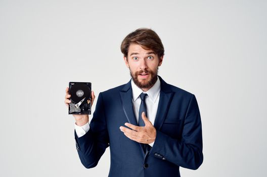 business man in suit and technology hard drive information