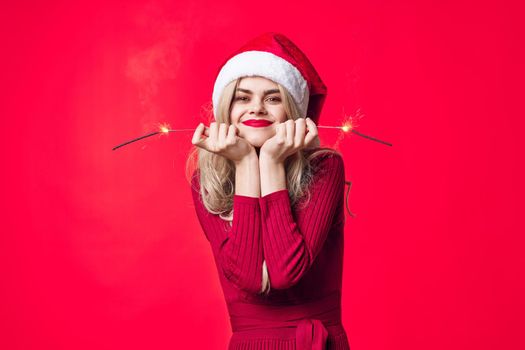 pretty woman in santa hat holiday christmas emotion sparklers