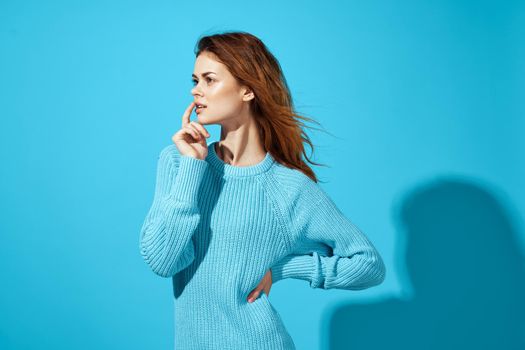 pretty woman fashion posing blue background Lifestyle. High quality photo
