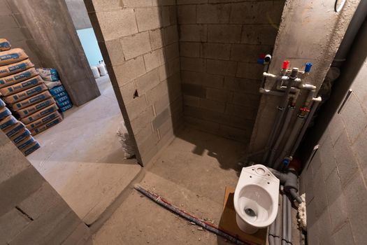 House Renovation of a Bathroom. plumbing and toilet.