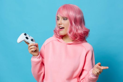 woman with a joystick in the hands of the game posing Lifestyle fashion. High quality photo