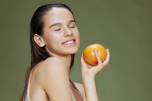 beautiful woman grapefruit in hands posing clean skin isolated background