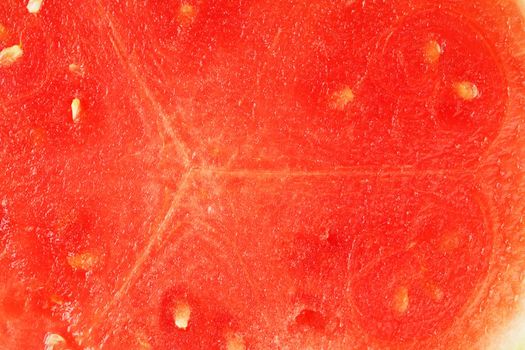 The texture of the juicy pulp of red watermelon close-up, full screen as a background