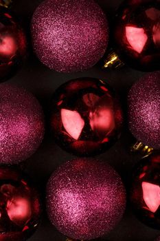 Purple Christmas balls close up as background. Full screen,