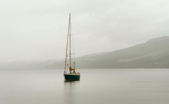 Landscape view of Loch Ness with calm water.