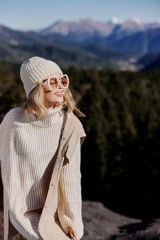 woman fashion glasses mountain top nature freedom landscape. High quality photo