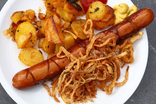 Close up portion of sausage with roasted potato