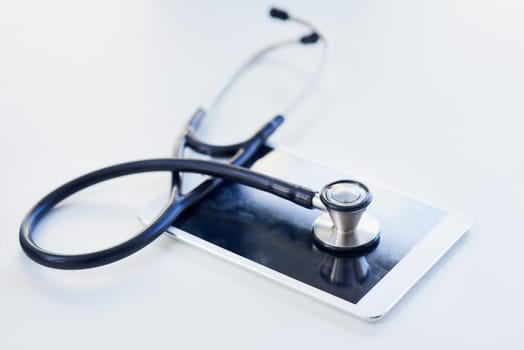 Shot of a stethoscope and digital tablet on a table