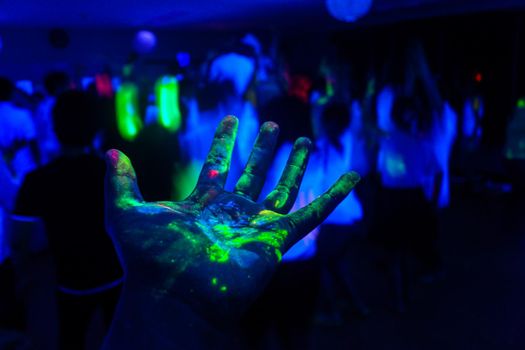 Hand with fluorescent paint