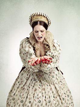 Ruling can be bloody business. Studio shot of a queen with blood on her hands.
