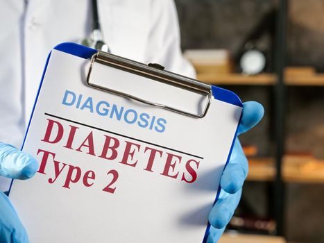 Doctor shows diabetes type 2 diagnosis in the medical form.