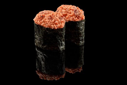 Gunkan maki sushi with eel on black background