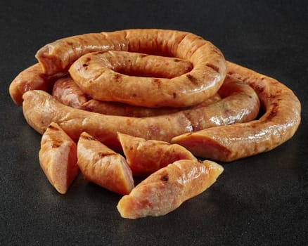 Slices of lightly smoked poultry sausages in natural casings