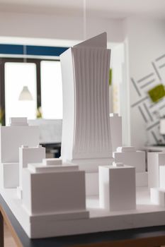 Closeup of 3D white foam architectural scale model of skyscraper building
