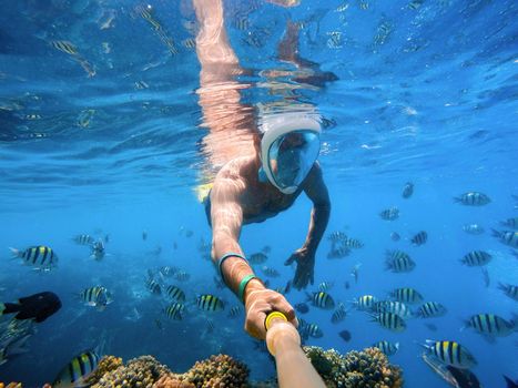 Snorkel swim in coral reef in Red sea, Egypt