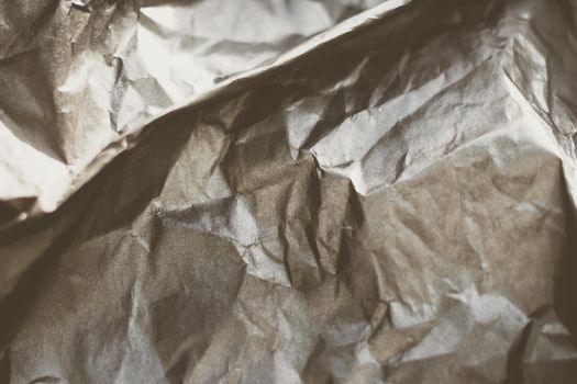 Abstract real paper surface background. Aluminum Platinum Silver foil. Wrinkled crumpled folds bend crush crease kink. Crystal, polygonal texture wave futurism 80s retro style new year. Brown tone