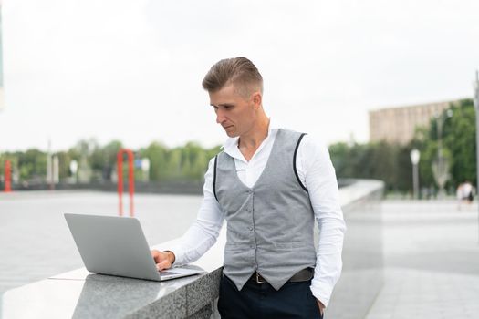 Business. Businessman Using Laptop Outdoors. Serious Pensive Caucasian Male Business Person Computer Outside Modern Technology Concept Young Adult Manager Crisis Thinking Trouble Idea