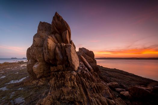 Tranquil sunset over rocky tor Batemans Bay Australia